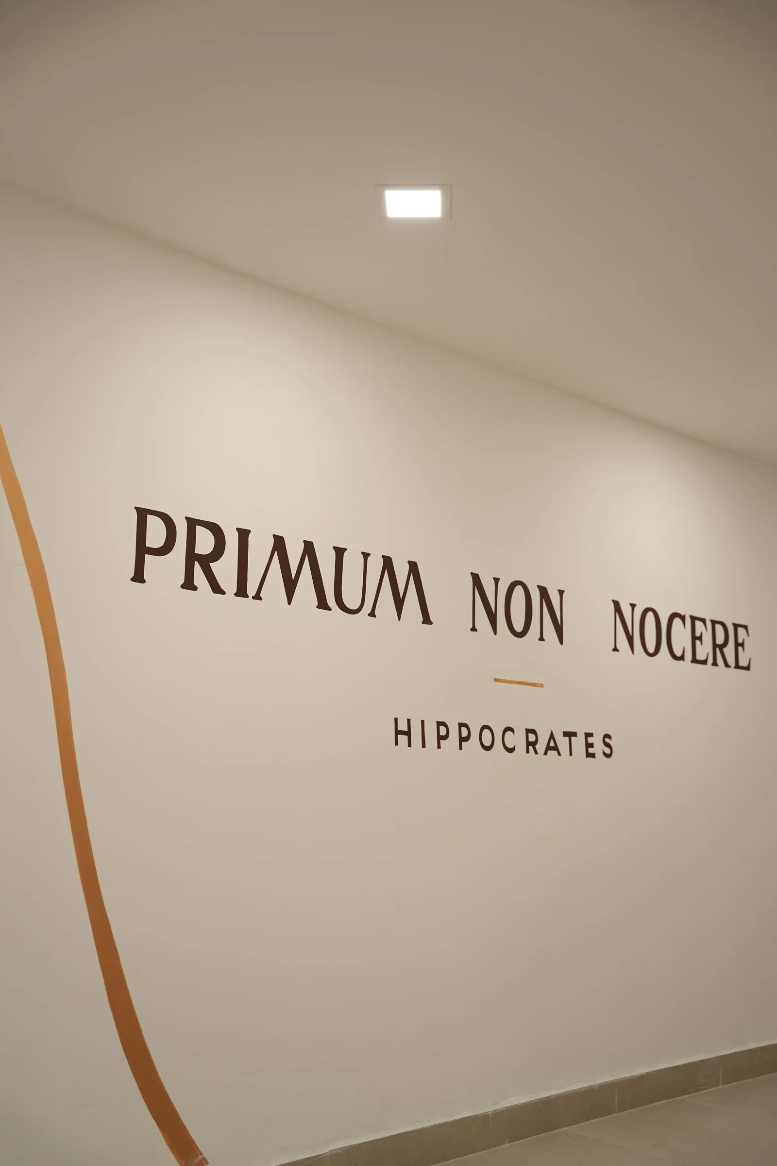 The clinic wall painted with Primum non nocere, Hippocrates: first, do no harm